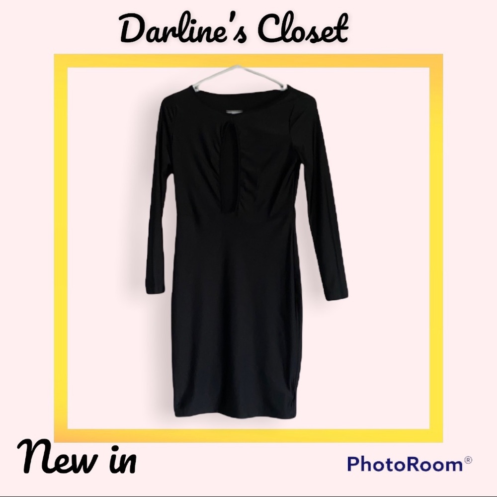 Black bodycon dress. Open slit for beautiful cleavage. Size small.